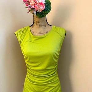 Sleeveless blouse with gentle draping at shoulders, front and sides.